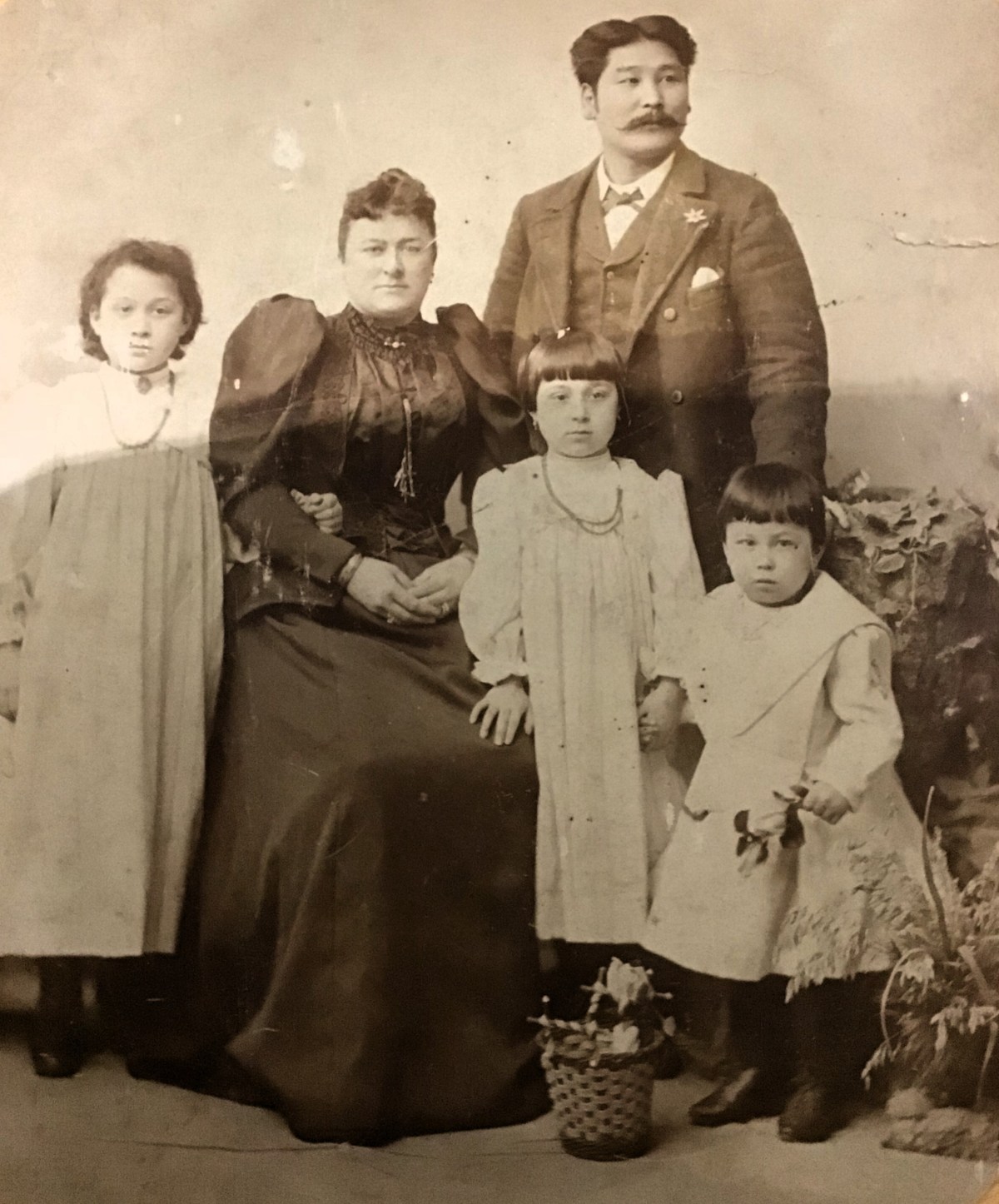 Photograph of Japanese man with moustache, wife, children 1892
